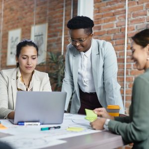 Team of multiracial businesswomen working on a meting at corporate office.